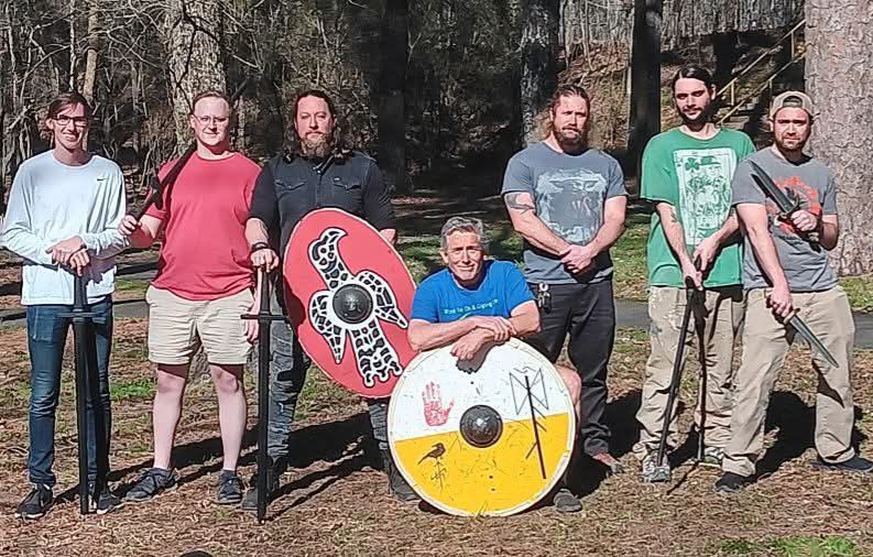 Group photo of Draugrstorm group with viking shields and swords